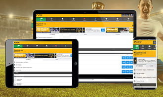Un laptop, uno smartphone e un tablet che mostrano l'app di Betfair